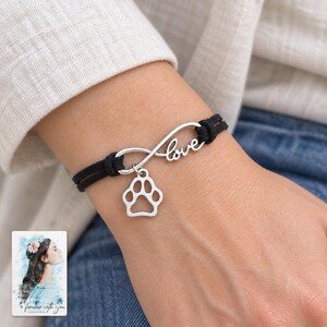 Infinity Love Paw Bracelet, worn by an adult. A sample personalized digital greeting card is shown alongside.