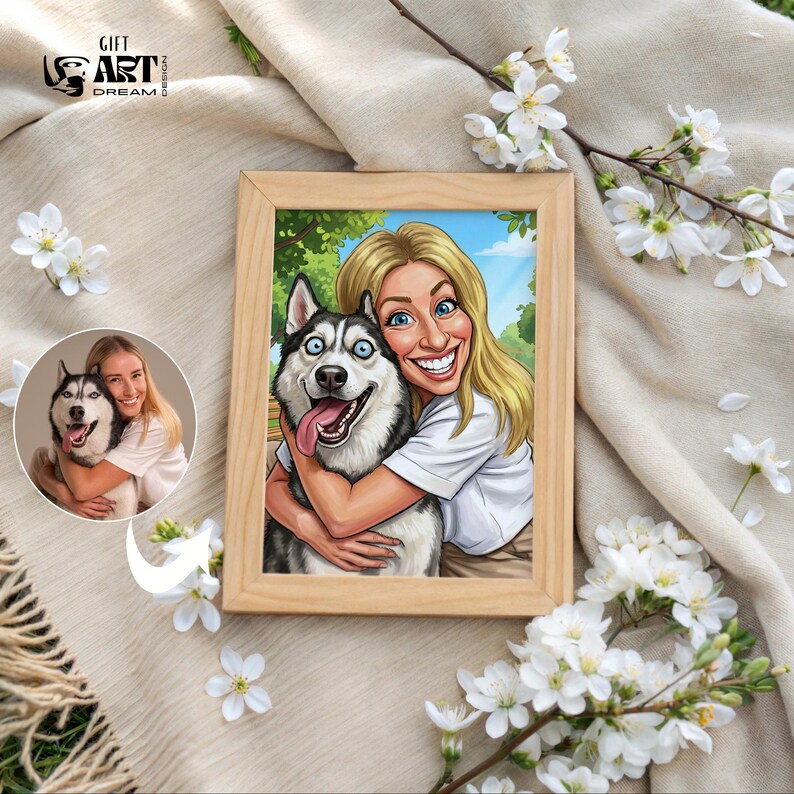 K&ouml;nnte beinhalten: Gerahmtes Cartoon-Portr&auml;t einer Frau, die einen Siberian Husky-Hund umarmt. Die Frau hat blondes Haar und blaue Augen, und der Hund hat blaue Augen und eine rosa Zunge. Der Rahmen ist aus hellem Holz. Der Text "GIFT ART DREAM" ist enthalten.