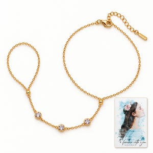 Golden Three stone style Hand Chain shown on a clean white catalog background for an unobstructed product view. A personalized digital greeting card is shown alongside.