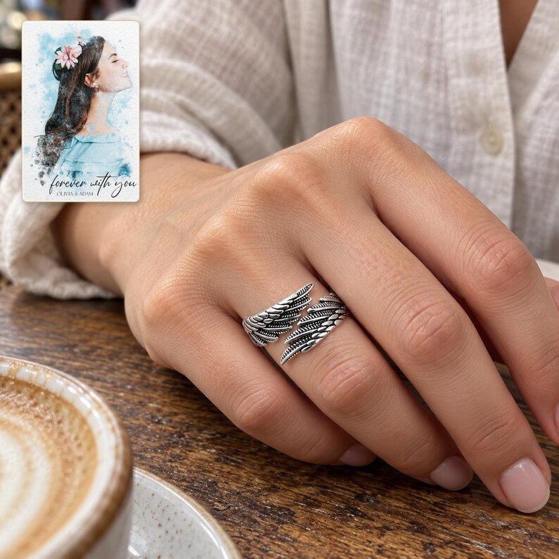 Angel Wings Wrap Ring, worn with daytime clothing. A sample personalized digital greeting card is shown alongside.