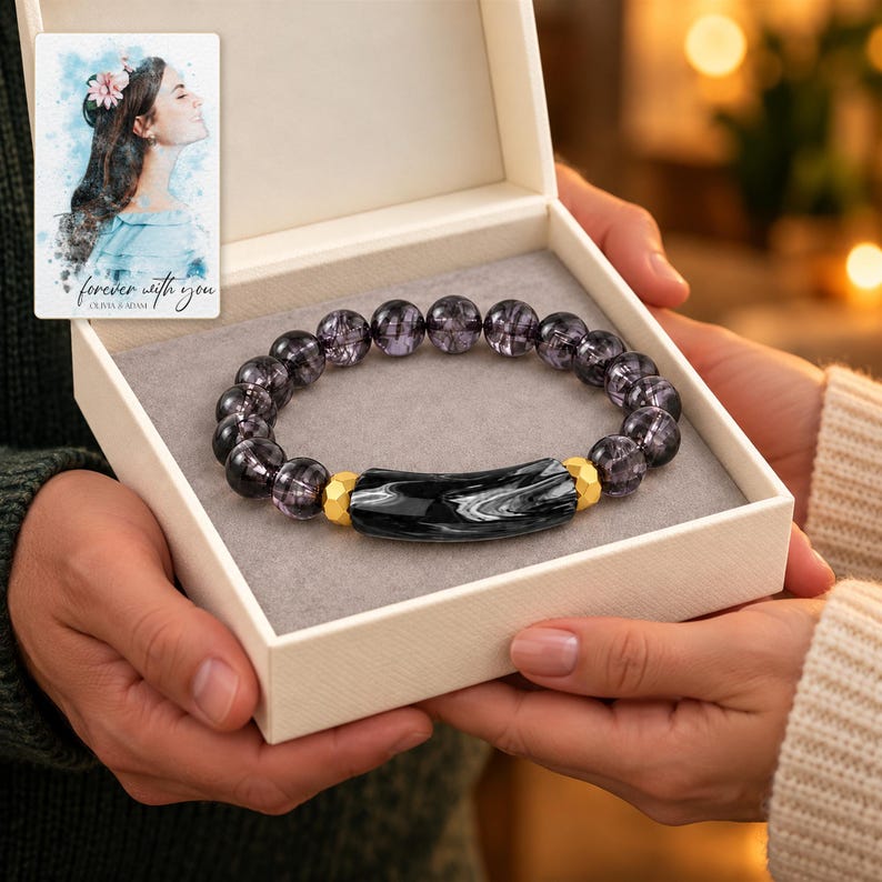 Midnight Marble Bar Bracelet shown during a warm gift-receiving moment between adults with the jewelry visible. A personalized digital greeting card is shown alongside.