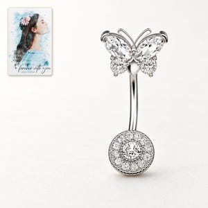 Front catalog view of the White butterfly navel bar, showing the complete curved bar and round clear accents-covered lower disc. A personalized digital greeting card is shown alongside.