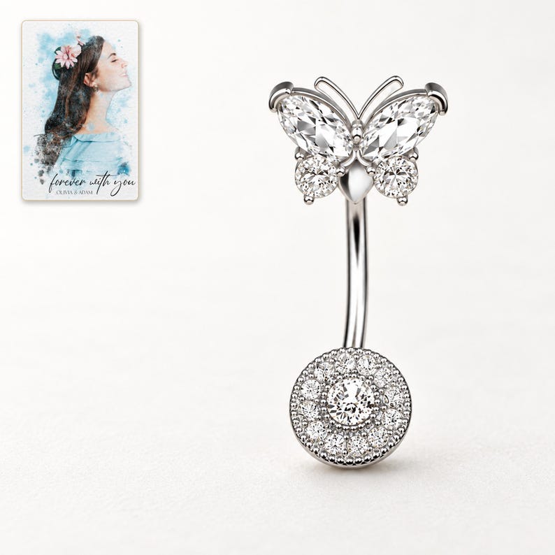 Front catalog view of the White butterfly navel bar, showing the complete curved bar and round clear accents-covered lower disc. A personalized digital greeting card is shown alongside.