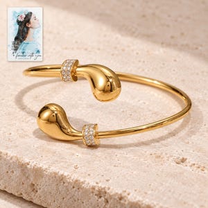 Gold Tone Cuff Bracelet, shown on a display surface. A sample personalized digital greeting card is shown alongside.