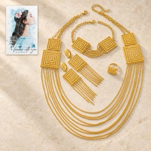 Golden Tassel Jewelry Suite shown as the main Etsy hero photograph with a clear view of the complete design. A personalized digital greeting card is shown alongside.