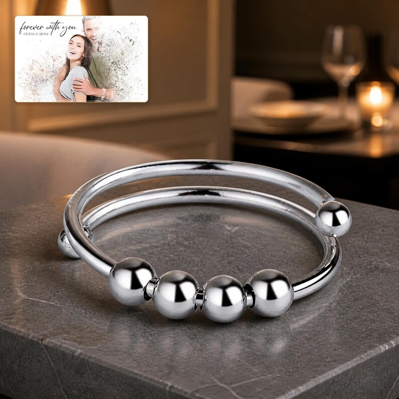 Orbit Five Bead Cuff arranged on soft ivory linen in a refined neutral flat lay.