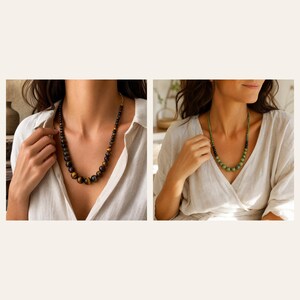 May include: A beaded necklace featuring round, polished tiger eye stones in shades of brown and gold, paired with a second necklace composed of round, smooth green beads that transition into smaller dark beads, both worn with a white shirt.