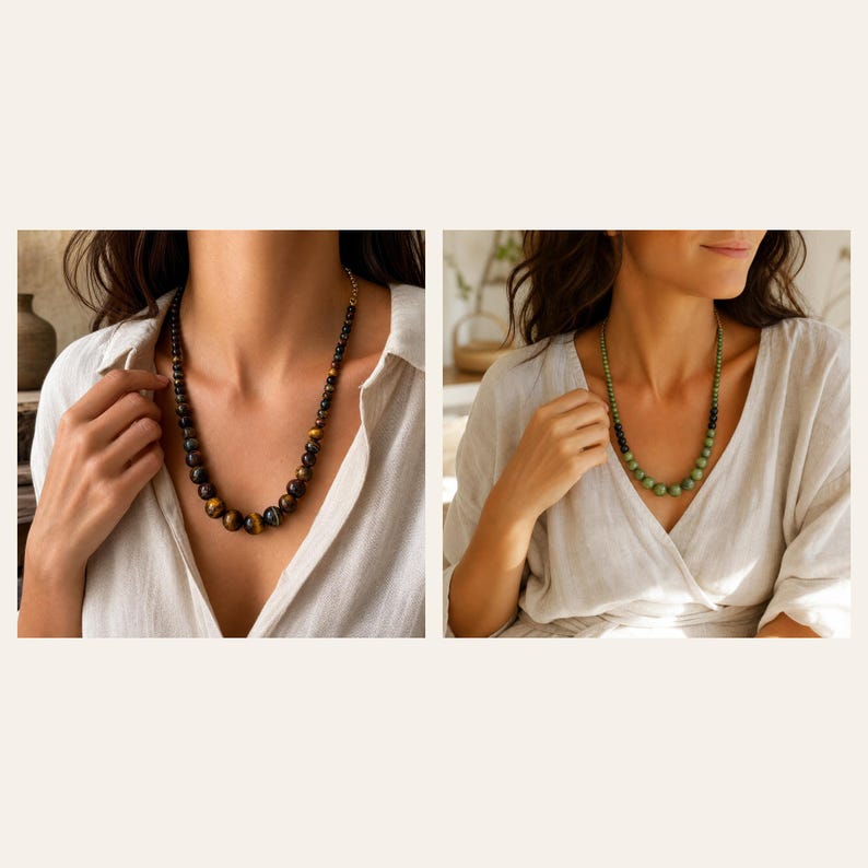May include: A beaded necklace featuring round, polished tiger eye stones in shades of brown and gold, paired with a second necklace composed of round, smooth green beads that transition into smaller dark beads, both worn with a white shirt.