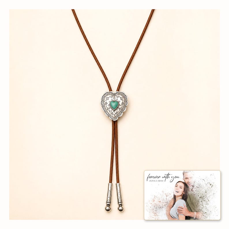 Brown cord bolo necklace with a silver-tone heart slide and turquoise-color center, catalog view. A personalized greeting-card example appears in the corner.