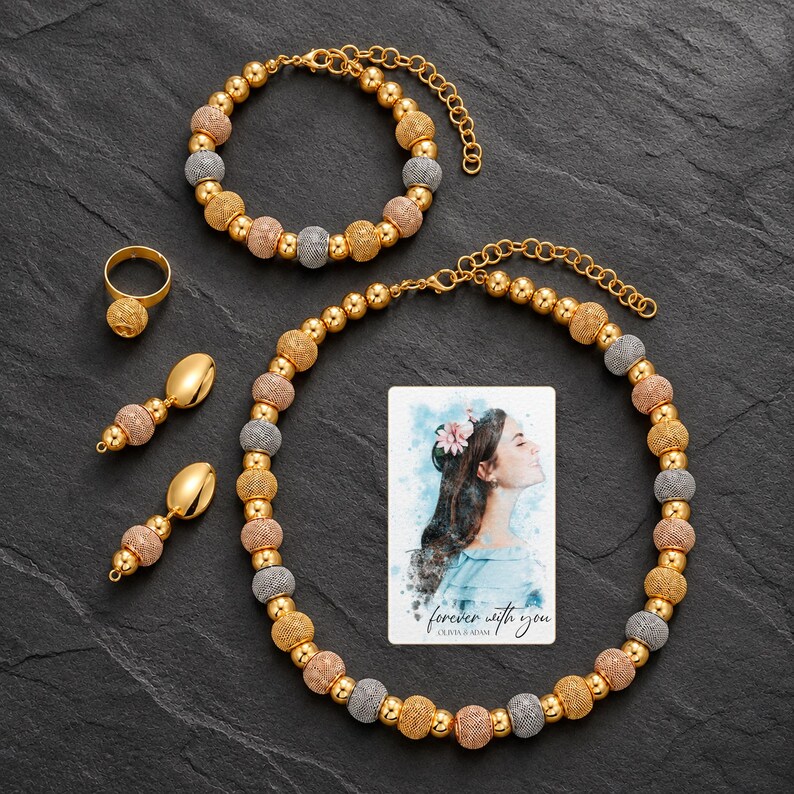 Metallic Bead Jewelry Suite styled against a dark luxury surface with the exact product finish clearly visible. A personalized digital greeting card is shown alongside.