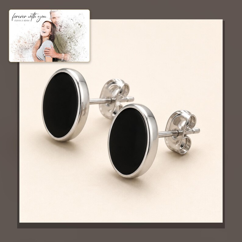 Black oval stud earrings with silver-tone edges, alternate framed view. A personalized greeting-card example appears in the corner.
