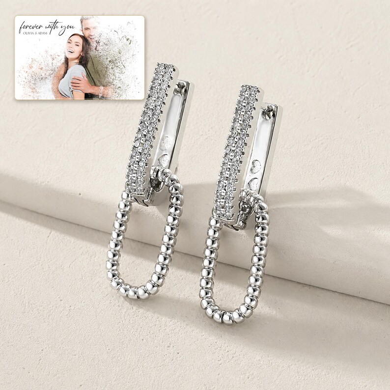 Silver Current Zircon Drops photographed in warm natural window light in an elegant home setting.