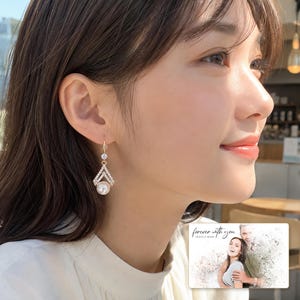 Champagne and white pearl-style chevron drop earring options displayed beside a personalized digital greeting card example. Choose one pair.