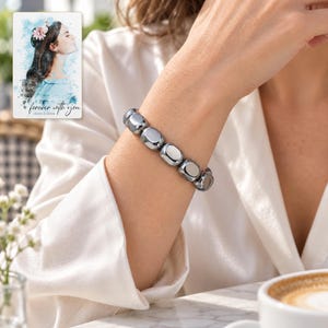 Metallic Grey Bead Bracelet, human lifestyle view. A personalized digital greeting card is shown alongside.