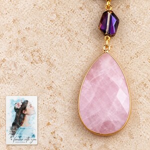 Close pendant-only detail of the pale-pink faceted teardrop, thin gold-tone rim and dark-purple faceted connector. A personalized digital greeting card is shown alongside.