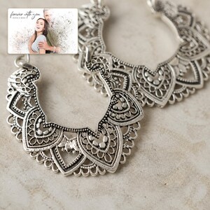 Antique Lace Boho Hoops shown during a warm gift-receiving moment between adults with the exact jewelry visible.