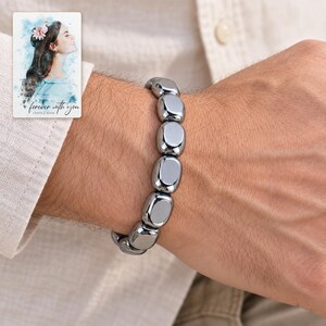 Metallic Grey Bead Bracelet, worn lifestyle view. A personalized digital greeting card is shown alongside.