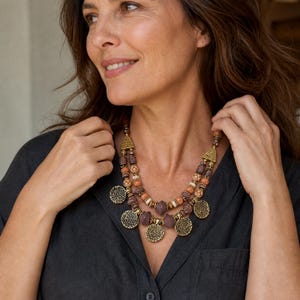 Three-piece handmade necklace set featuring rose gold and bronze beaded necklace, rose gold and gray beaded necklace and rose gold and silver beaded necklace, displayed together to show the coordinated colors and beadwork