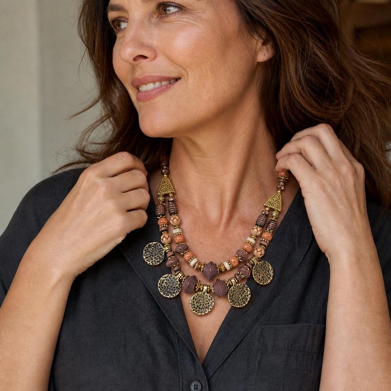 Three-piece handmade necklace set featuring rose gold and bronze beaded necklace, rose gold and gray beaded necklace and rose gold and silver beaded necklace, displayed together to show the coordinated colors and beadwork