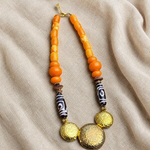 Gift ready presentation of Orange and Beige Statement Beaded Necklace, Boho Handmade Jewelry, Artisan Gift for Her in an open jewelry box lined with natural ivory linen