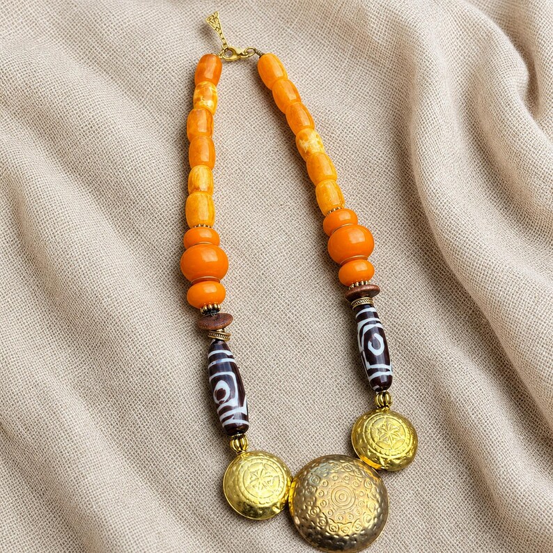 Gift ready presentation of Orange and Beige Statement Beaded Necklace, Boho Handmade Jewelry, Artisan Gift for Her in an open jewelry box lined with natural ivory linen