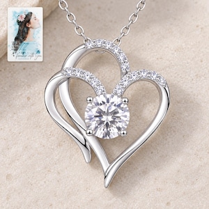 Double Heart Pendant Necklace, shown on a display surface. A sample personalized digital greeting card is shown alongside.
