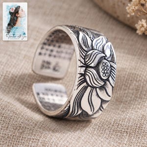 Lotus Flower Open Ring, laid on fabric. A sample personalized digital greeting card is shown alongside.