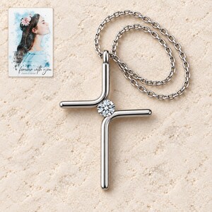 Cross Pendant Necklace, shown on a display surface. A sample personalized digital greeting card is shown alongside.