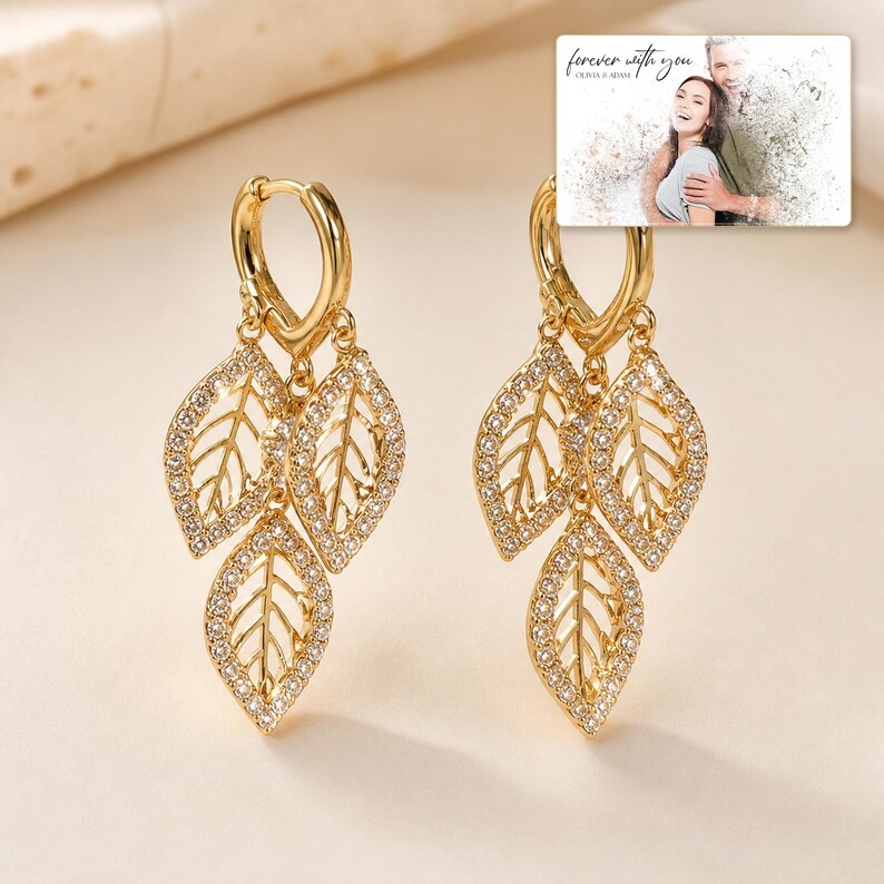 Gilded Leaf Cluster Clips photographed in warm natural window light in an elegant home setting.