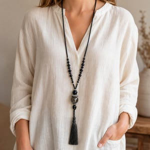 Gray and White Statement Beaded Necklace presented in an open jewelry gift box on natural linen