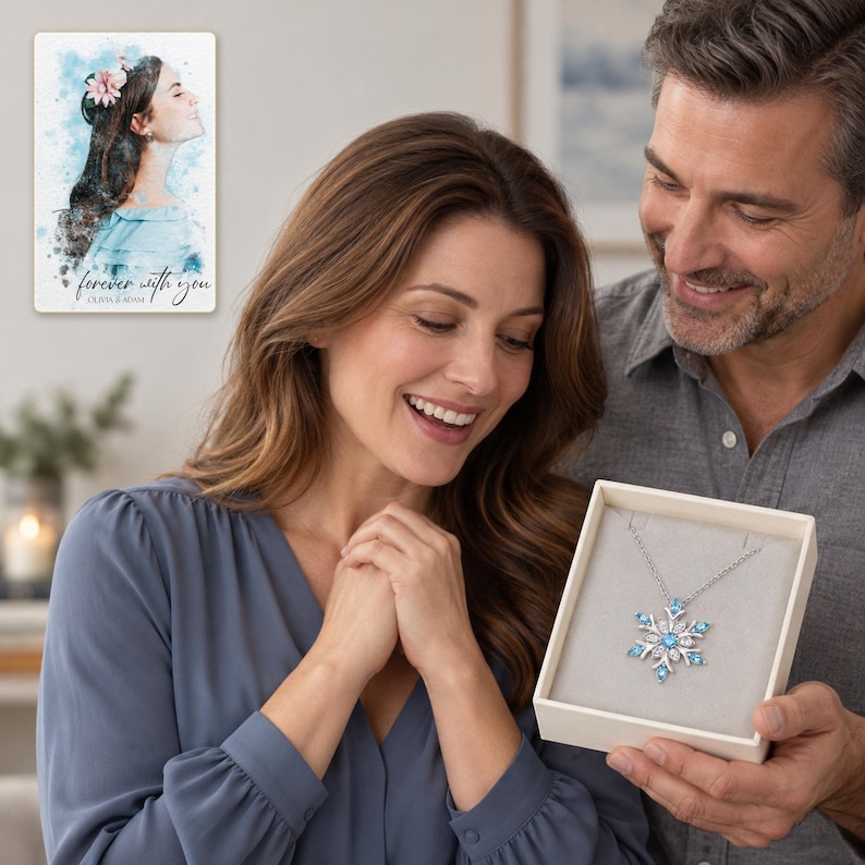 Winter Azure Snowflake Necklace shown during a believable gift-giving moment between adults with the jewelry visible. A personalized digital greeting card is shown alongside.