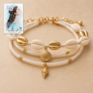 Beach Muse Three-Piece Shell Anklet Set shown during a warm gift-receiving moment between adults with the exact jewelry visible.