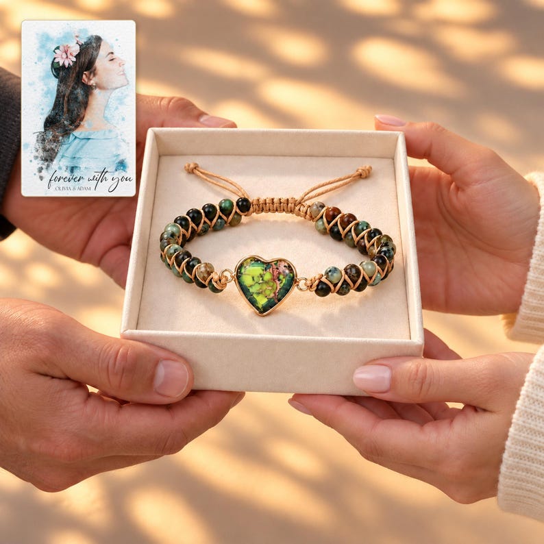 Verdant Heart Woven Bracelet shown during a warm gift-receiving moment between adults with the jewelry visible. A personalized digital greeting card is shown alongside.