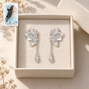 Butterfly Drop Earrings, displayed in a presentation box. A sample personalized digital greeting card is shown alongside.