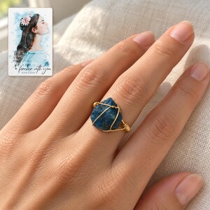 Blue Wire Wrapped Ring, worn lifestyle view. A personalized digital greeting card is shown alongside.