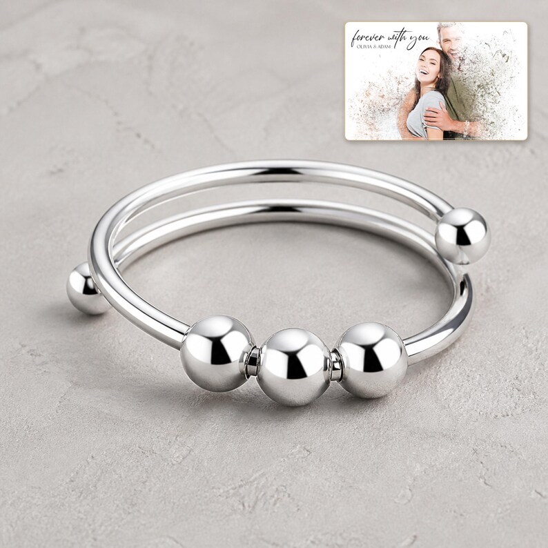 Orbit Five Bead Cuff photographed in warm natural window light in an elegant home setting.
