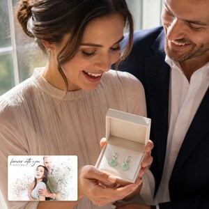 Celadon Jade Look Ear Clips shown during a warm gift-receiving moment between adults with the exact jewelry visible.