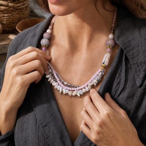 Three-piece handmade necklace set featuring bronze and beige beaded necklace, brown and bronze beaded necklace and gray and bronze beaded necklace, displayed together to show the coordinated colors and beadwork