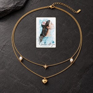 Layered Heart Necklace, shown against a dark background. A sample personalized digital greeting card is shown alongside.