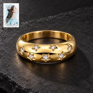 Star Set Moissanite Ring, shown against a dark background. A sample personalized digital greeting card is shown alongside.