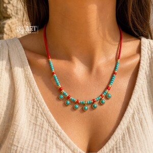 Gift box and close-up detail photo of turquoise and red beaded gold tone charm necklace for handmade jewelry gifting