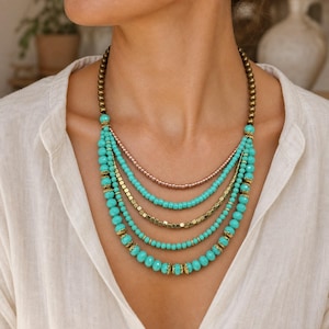 Gray and Silver Statement Beaded Necklace presented in an open jewelry gift box on natural linen