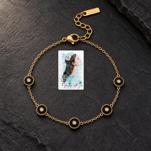 Black Disc Bracelet, shown against a dark background. A sample personalized digital greeting card is shown alongside.