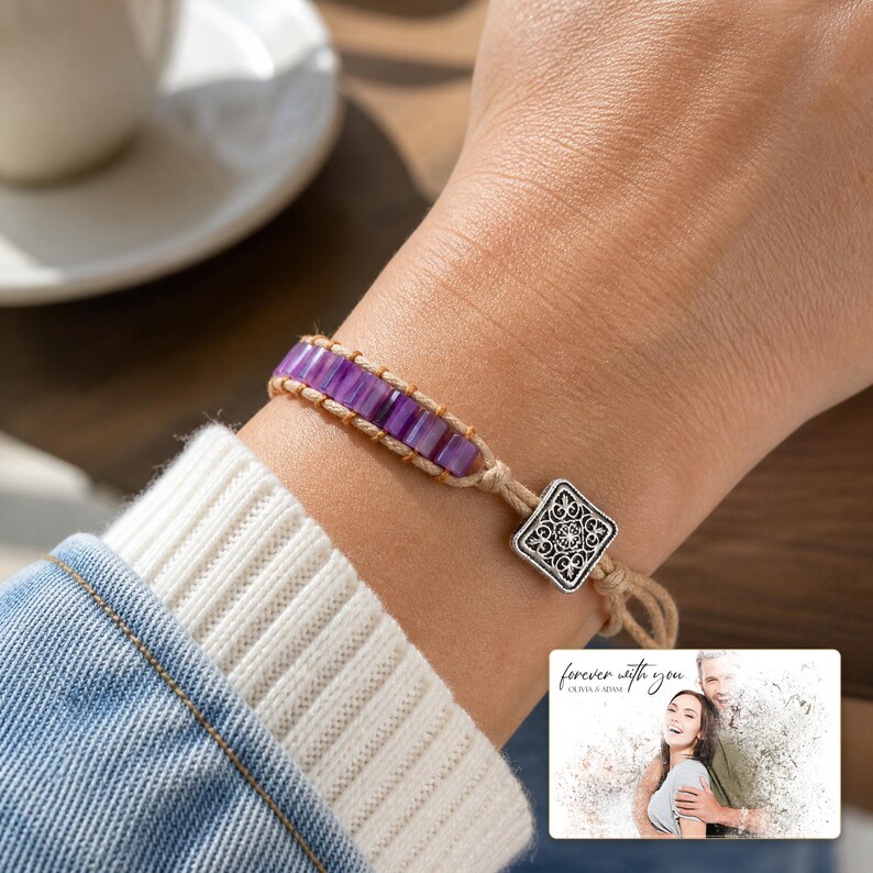 Purple rectangular-bead cord bracelet with a square decorative detail, adult lifestyle view. A personalized greeting-card example appears in the corner.
