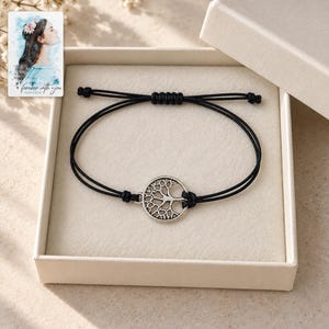 Tree of Life Cord Bracelet, displayed in a presentation box. A sample personalized digital greeting card is shown alongside.