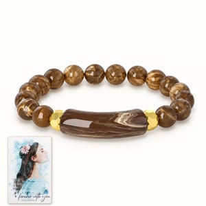Cocoa Swirl Bar Bracelet shown on a clean white catalog background for an unobstructed product view. A personalized digital greeting card is shown alongside.