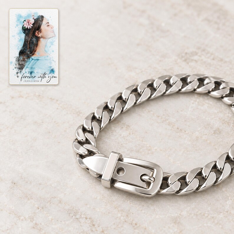 Close view of the closed belt buckle, with keeper bar, pointed tab, one empty adjustment hole and the pin-held hole. A personalized digital greeting card is shown alongside.