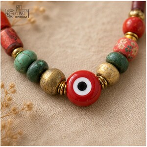 Three-piece handmade necklace set featuring red evil eye beaded necklace, red evil eye beaded necklace and lavender evil eye beaded necklace, displayed together to show the coordinated colors and beadwork