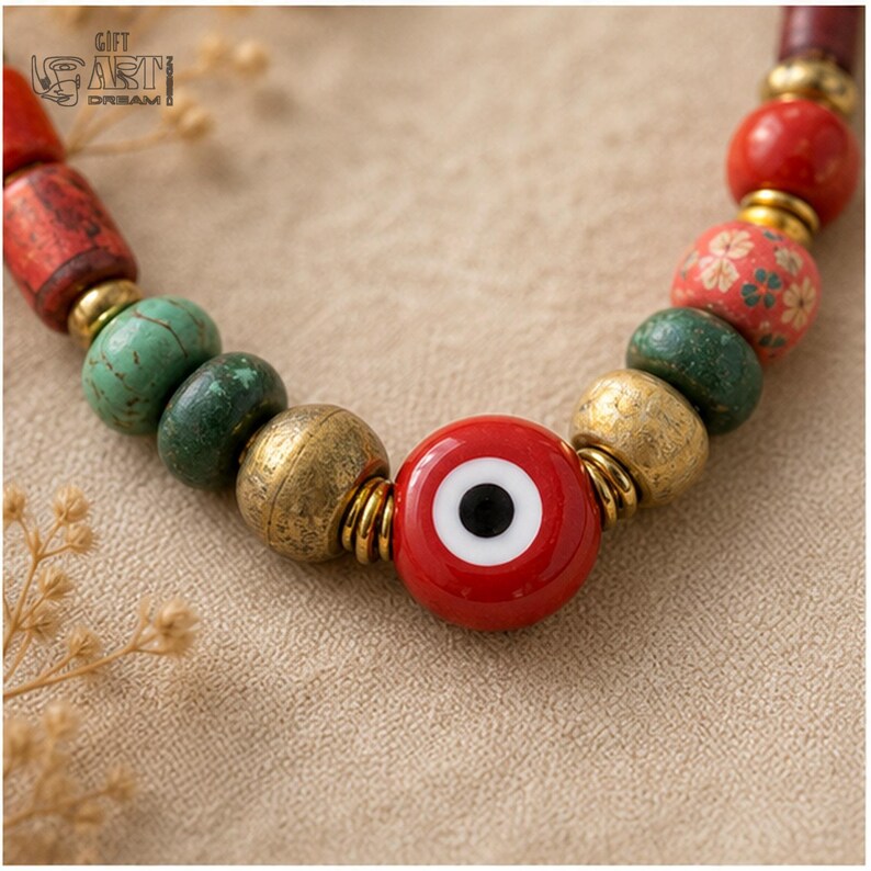 Three-piece handmade necklace set featuring red evil eye beaded necklace, red evil eye beaded necklace and lavender evil eye beaded necklace, displayed together to show the coordinated colors and beadwork