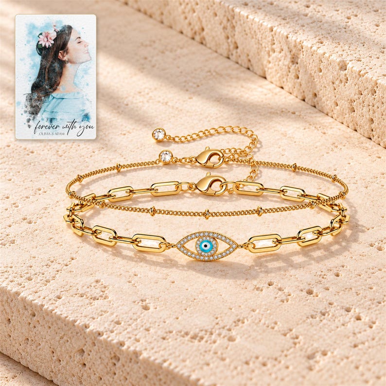 Gold Tone Evil Eye Bracelet Duo shown as the main Etsy hero photograph with a clear view of the complete design. A personalized digital greeting card is shown alongside.